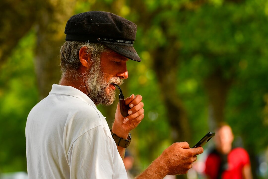 elderly man using smartphone