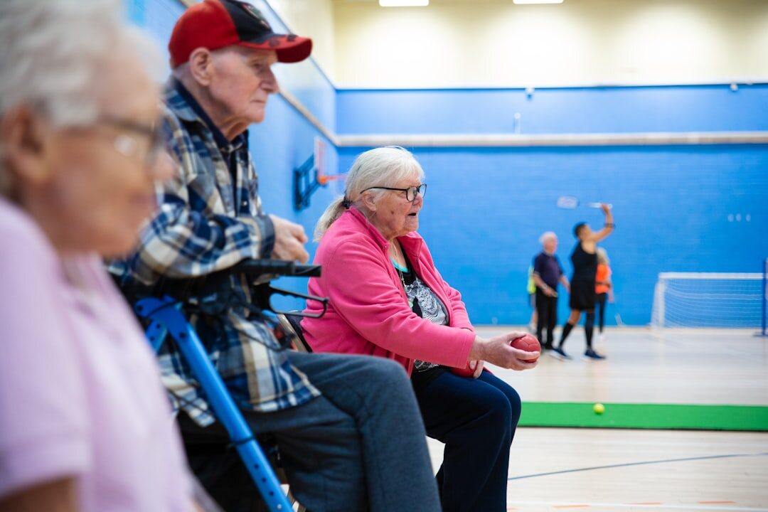 group of seniors chatting in community hall